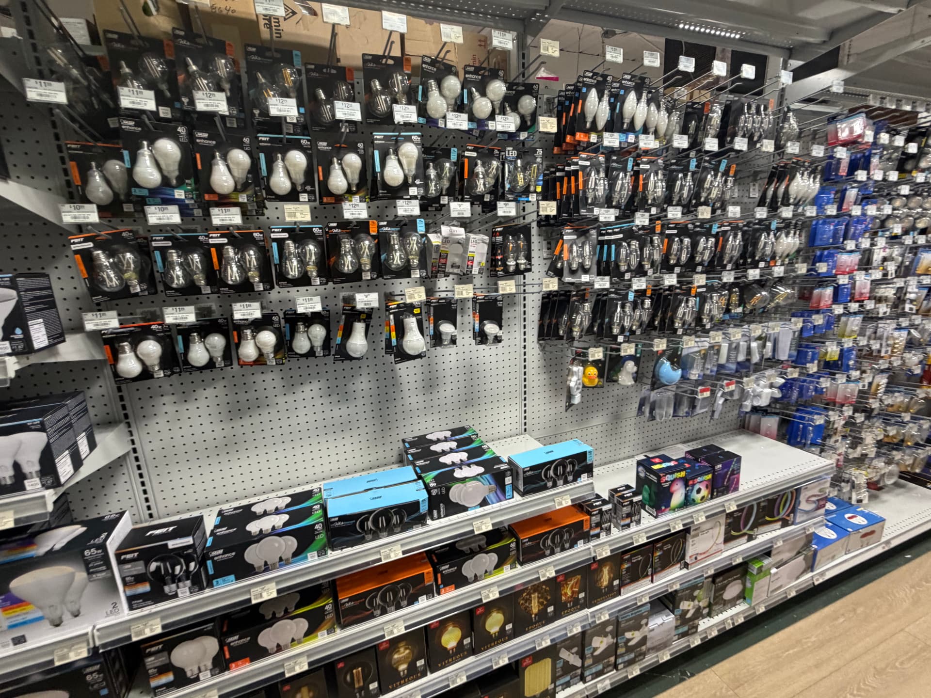 Wall of LED light bulbs — A19, filament, flood and decorative — in the electrical aisle at Hessler Paint & Hardware in Delray Beach, Florida.