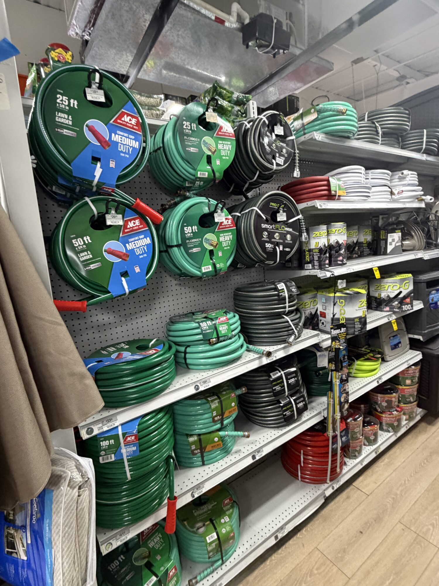 A wide selection of Ace brand garden hoses, smartFLO hoses, and Zero-G flexible hoses at Hessler Paint & Hardware in Delray Beach, Florida.