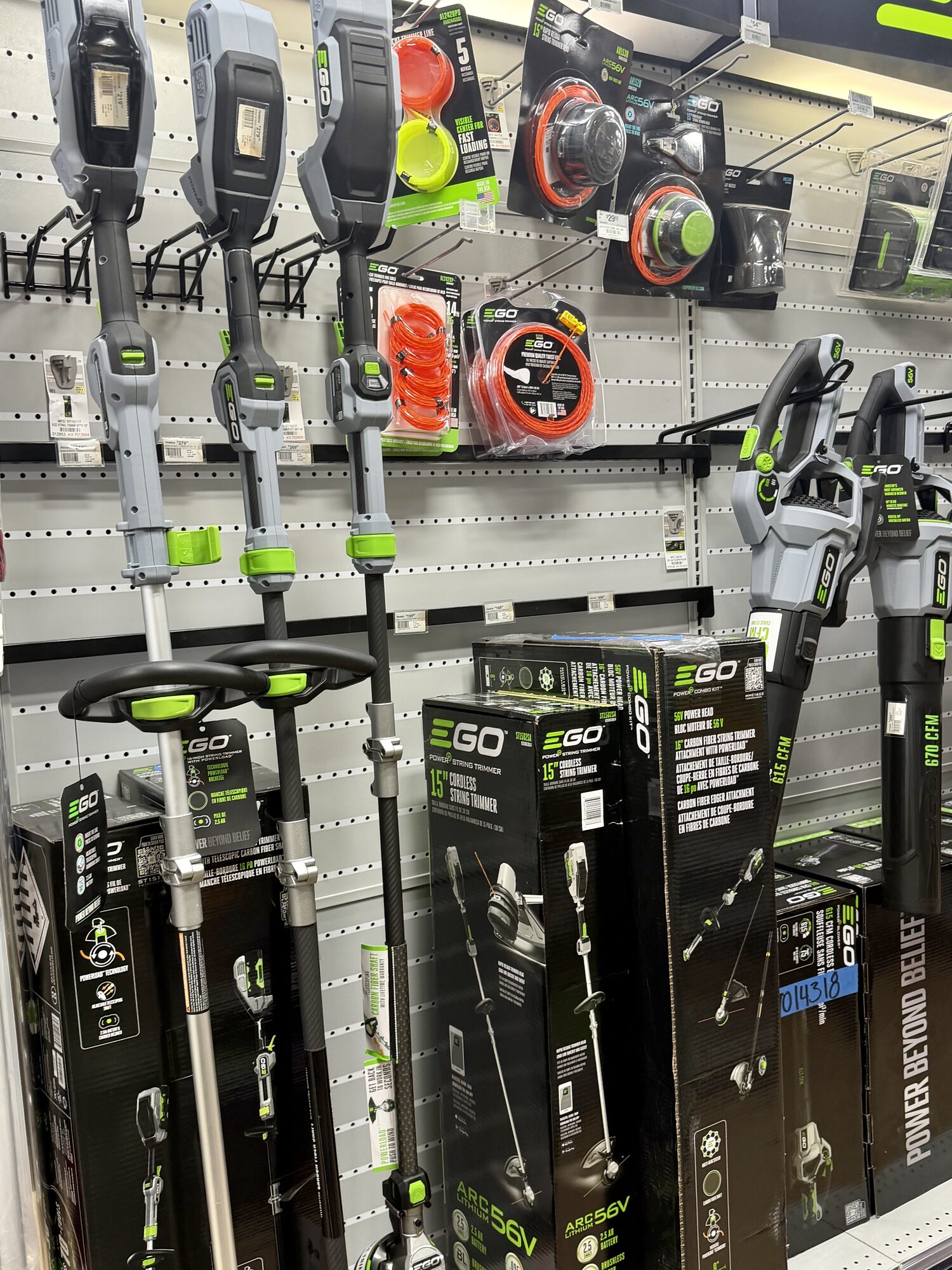 EGO Power+ string trimmers, leaf blowers, and replacement trimmer line on display at Hessler Paint & Hardware in Delray Beach, Florida.