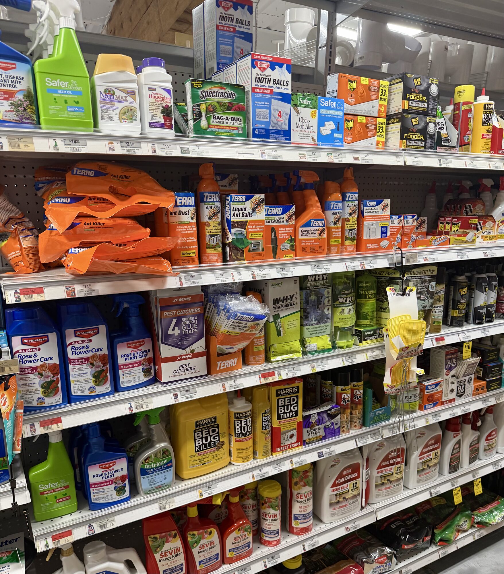 Shelves stocked with Terro ant killer, Spectracide, Safer brand insect soap, Harris bed bug killer, and Sevin dust at Hessler Paint & Hardware in Delray Beach, Florida.