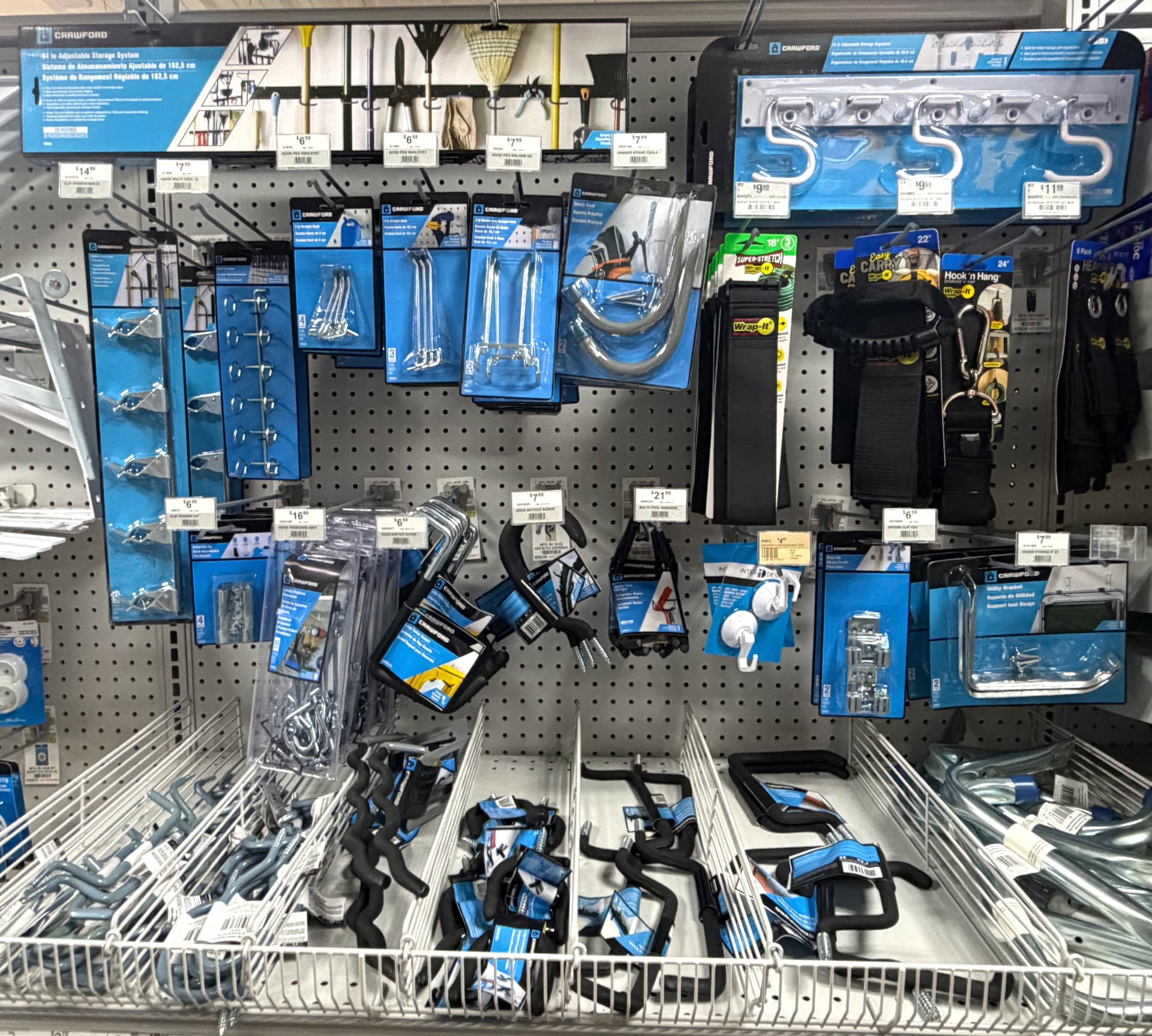 Pegboard wall of Crawford garage hooks, tool hangers, bike hooks and Wrap-It storage straps