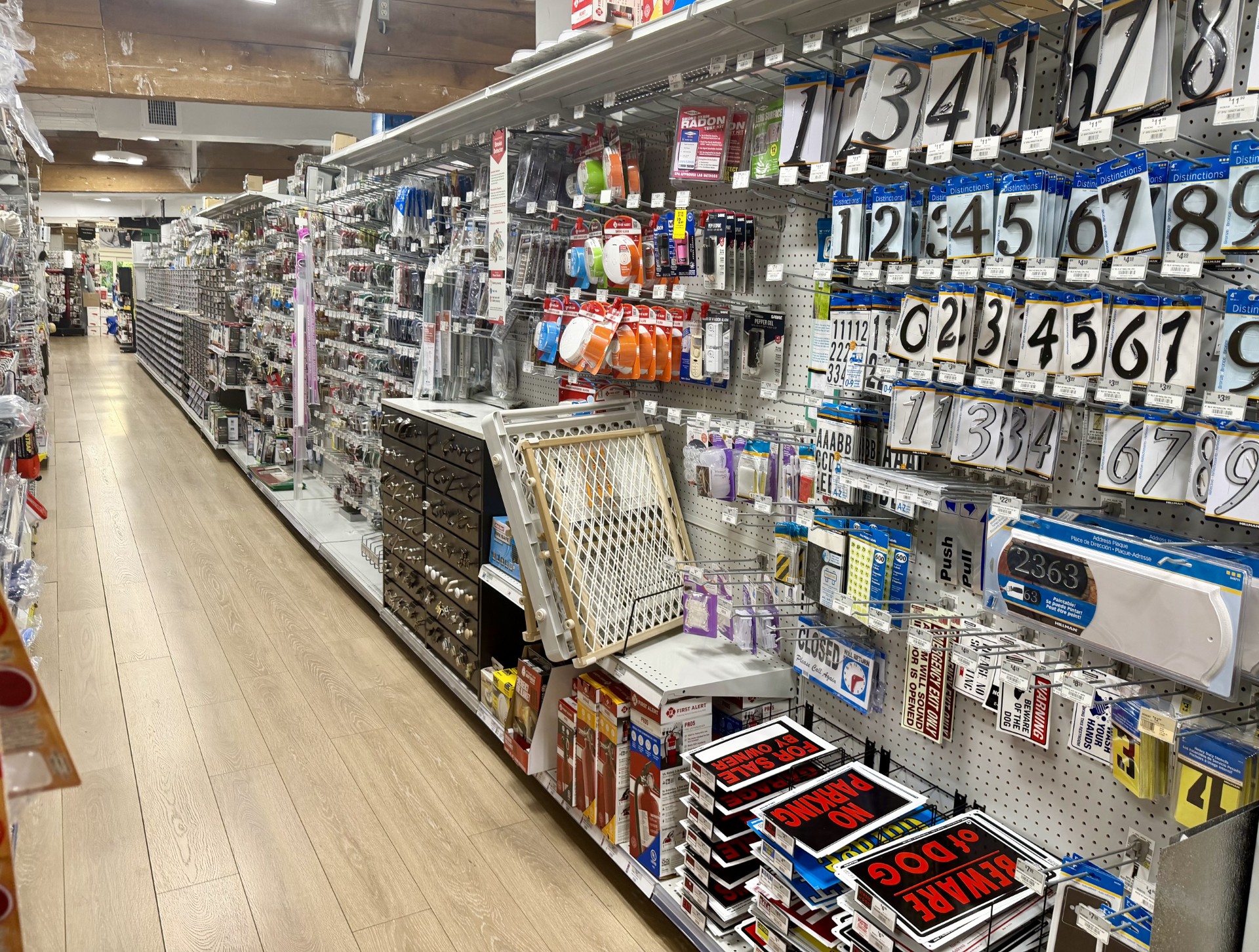 Hardware aisle with house numbers, letters, address plaques and yard signs