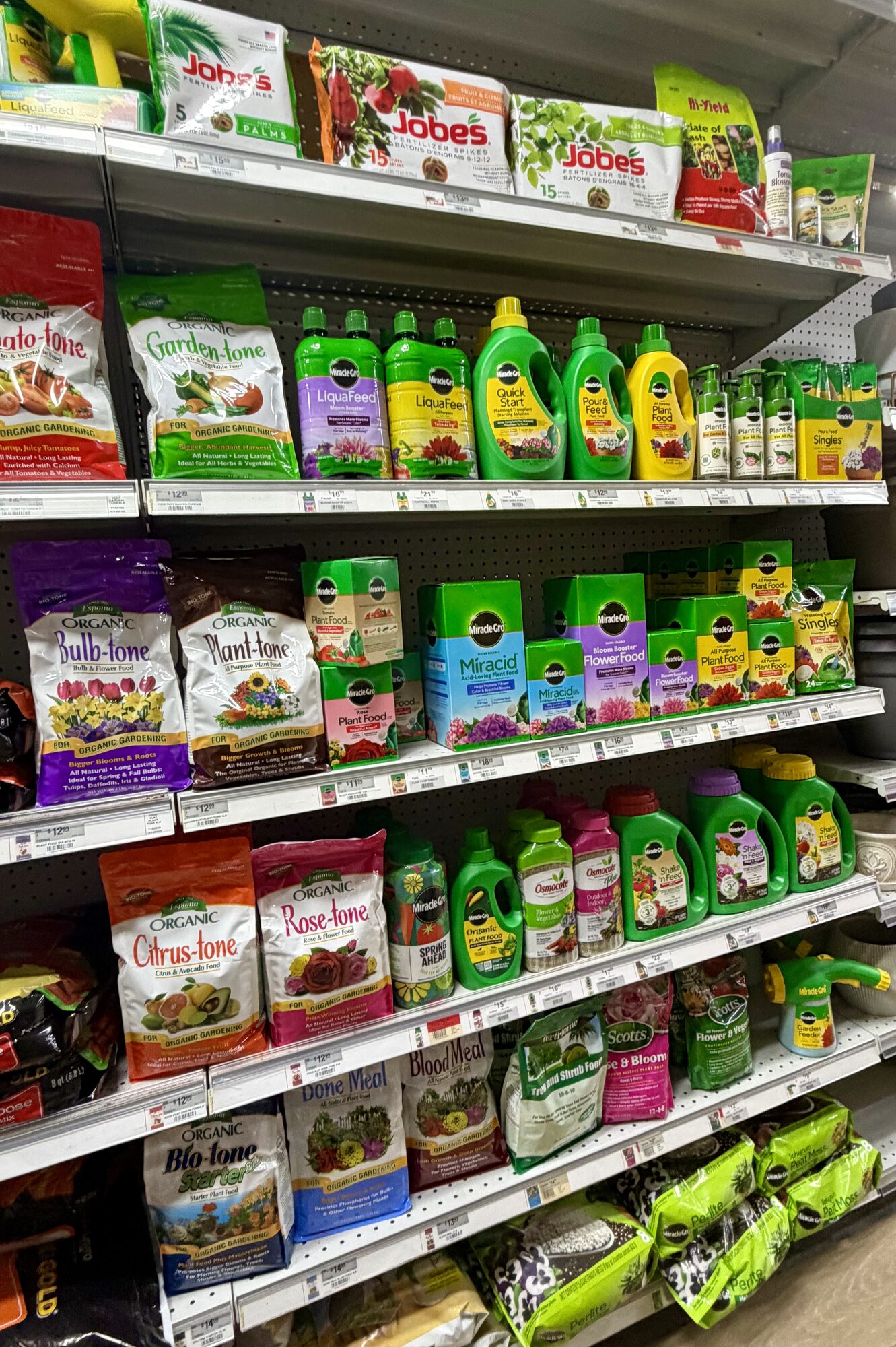 Shelves of Jobe's, Espoma Organic Garden-tone, Bulb-tone, and Miracle-Gro fertilizers at Hessler Paint & Hardware in Delray Beach, Florida.