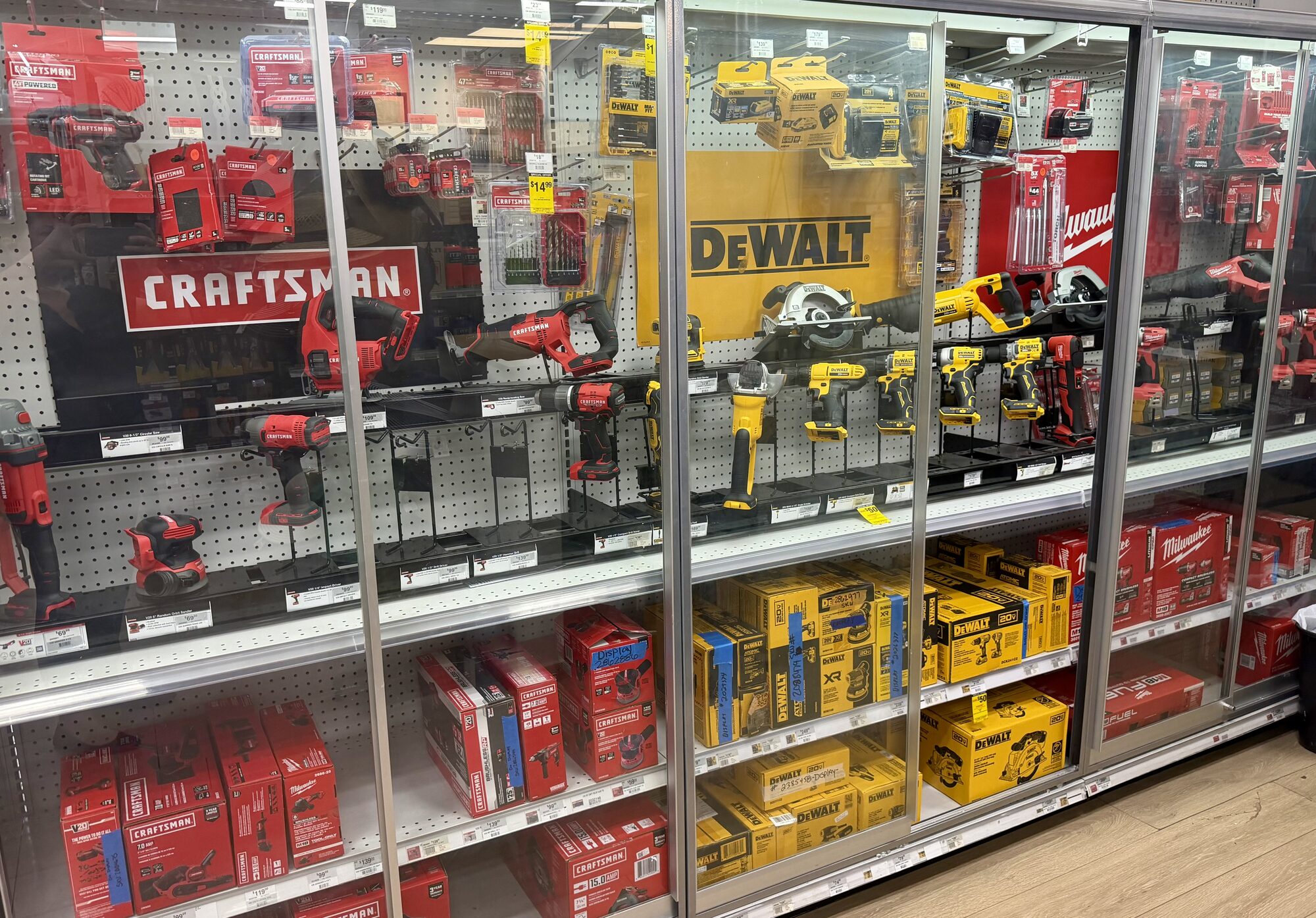 A wide selection of DeWalt, Craftsman, and Milwaukee power tools including drills, saws, and batteries at Hessler Paint & Hardware in Delray Beach, Florida.