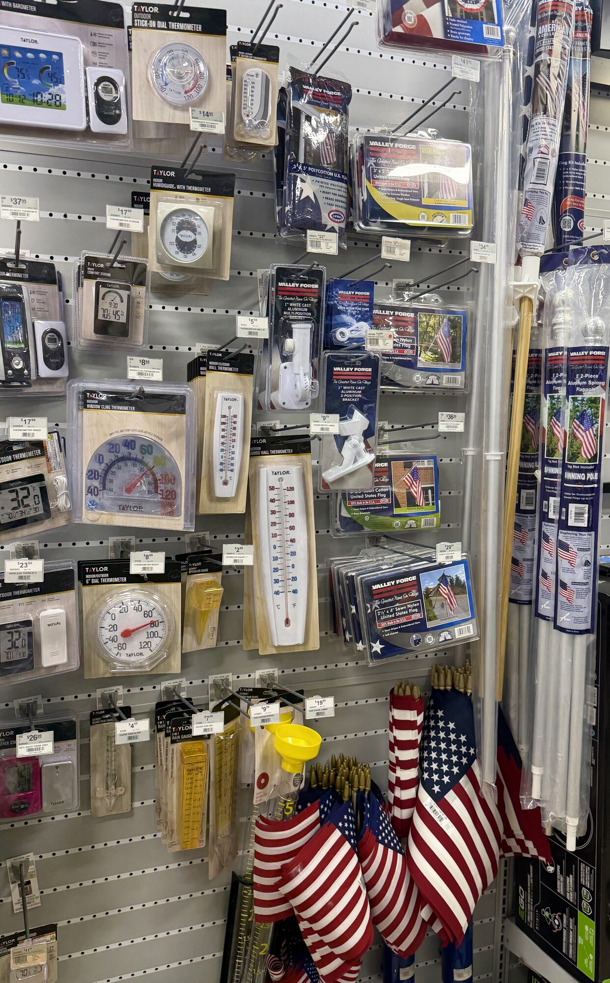 Display of Taylor outdoor thermometers, hygrometers, and Valley Forge American flags at Hessler Paint & Hardware in Delray Beach, Florida.
