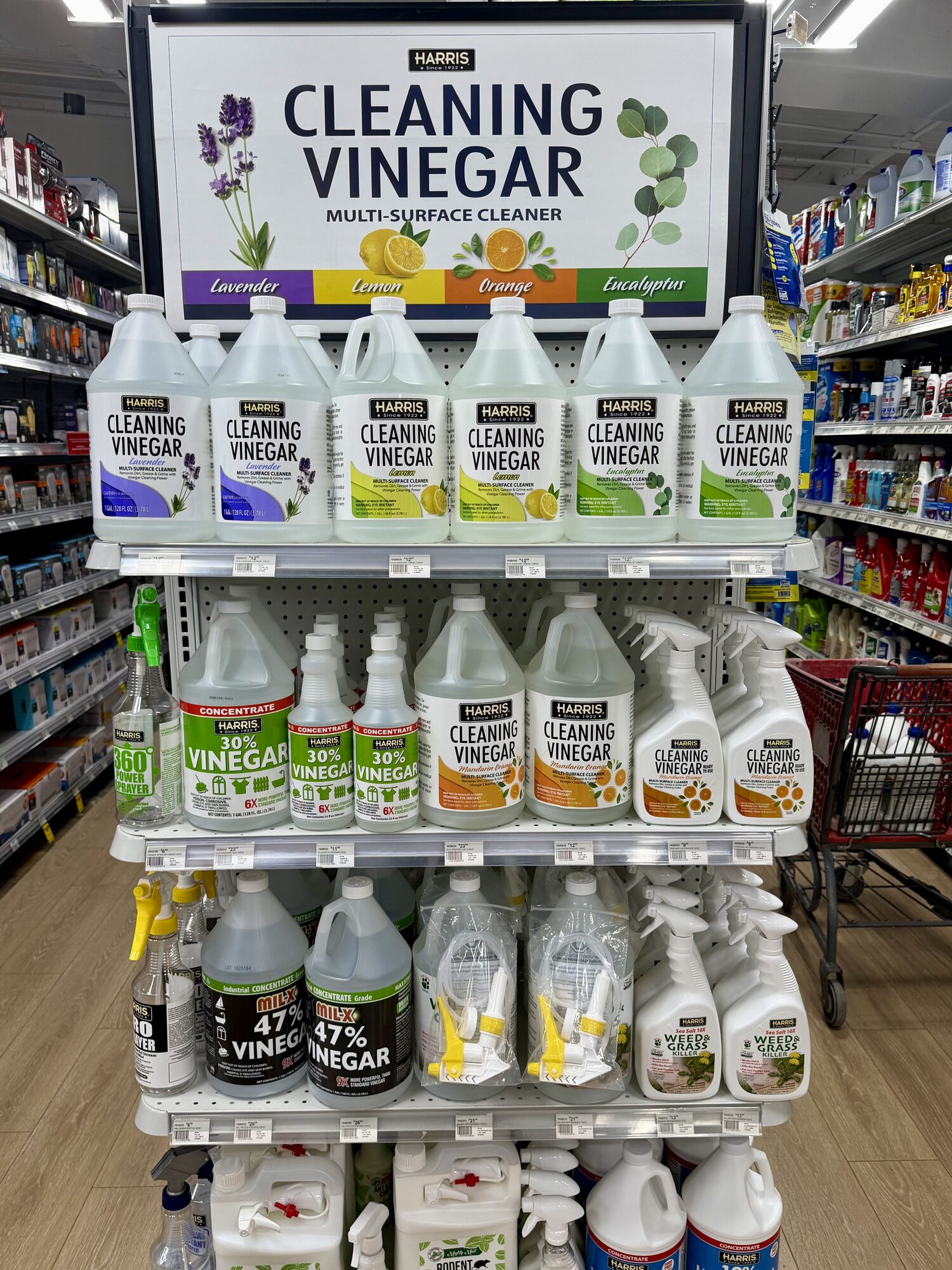 Shelves of Harris Cleaning Vinegar, including 30% and 47% concentrations and spray bottles, at Hessler Paint & Hardware in Delray Beach, Florida.