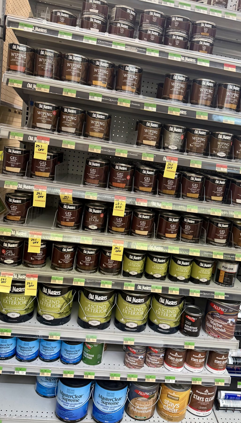 Shelves fully stocked with Old Masters wiping stains, gel stains, Ascend Exterior finishes, and Benjamin Moore clear coatings at Hessler Paint & Hardware in Delray Beach, Florida.
