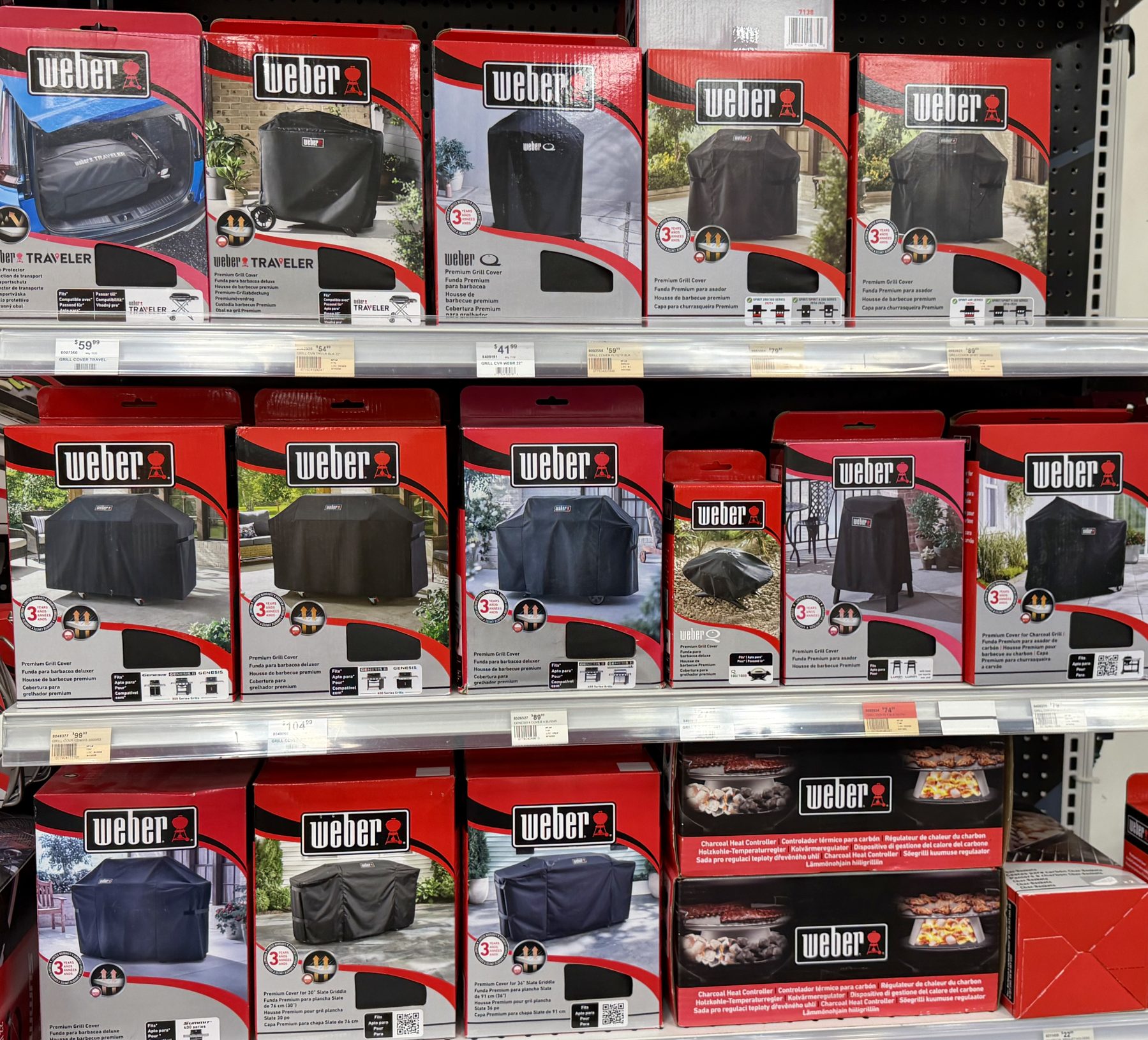 Shelves filled with packaged Weber brand grill covers and barbecue accessories at Hessler Paint & Hardware in Delray Beach, Florida.