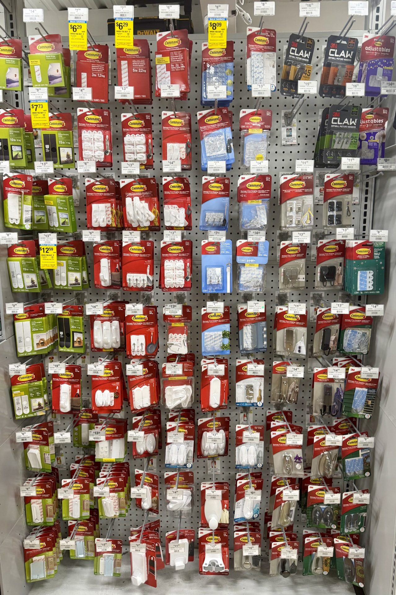 3M Command hooks, picture hanging strips and drywall picture hangers on a pegboard