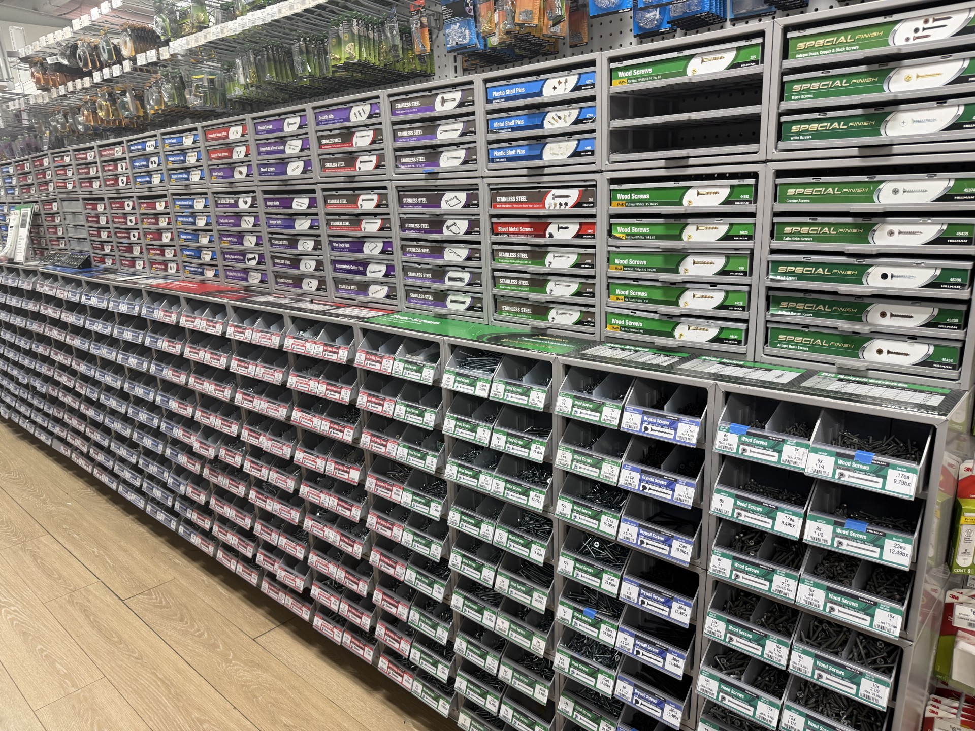 Hillman fastener bin wall with loose wood screws, drywall screws and stainless fasteners at Hessler Ace Hardware in Delray Beach