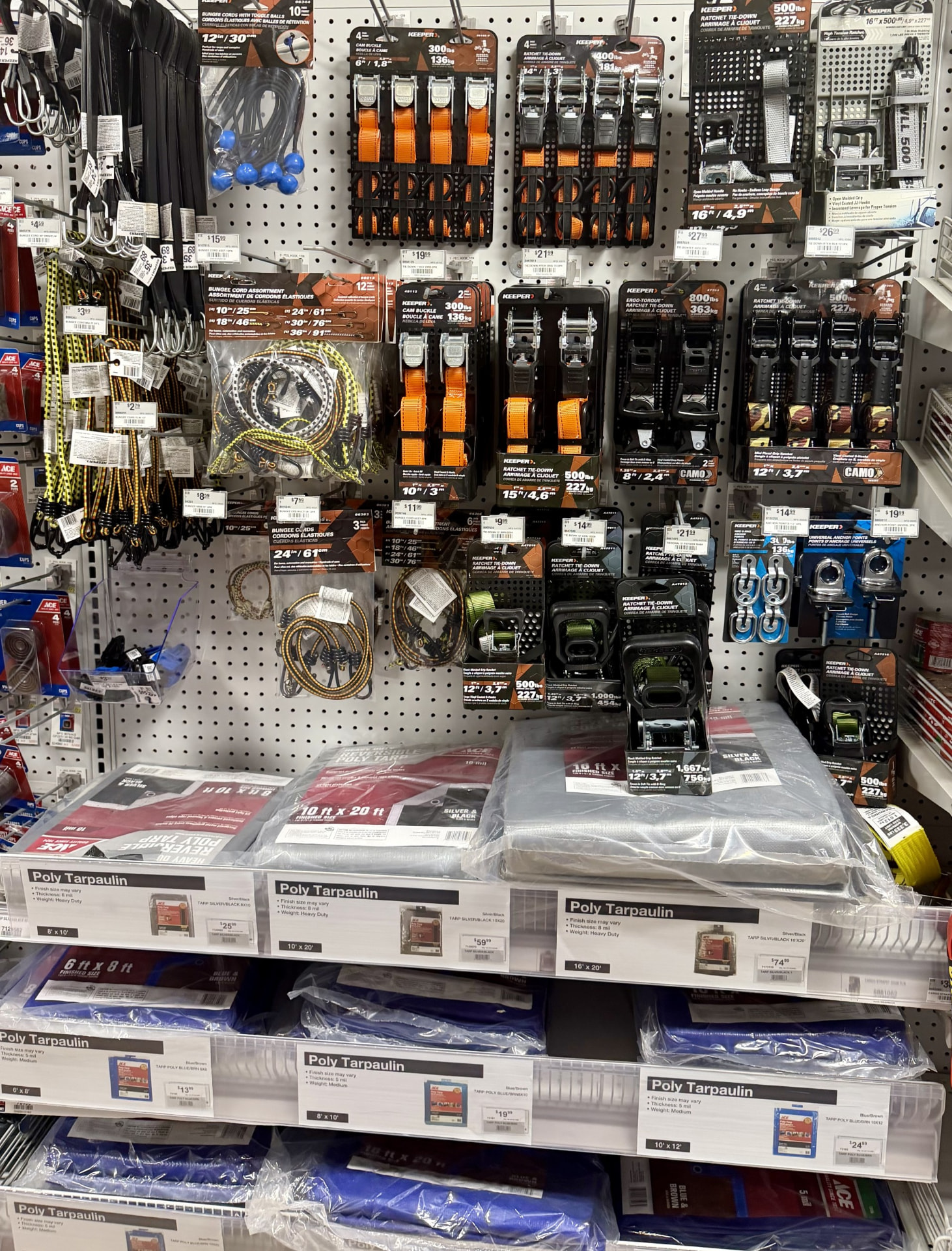 Display of bungee cords, ratchet tie-downs, cam buckle straps and poly tarps
