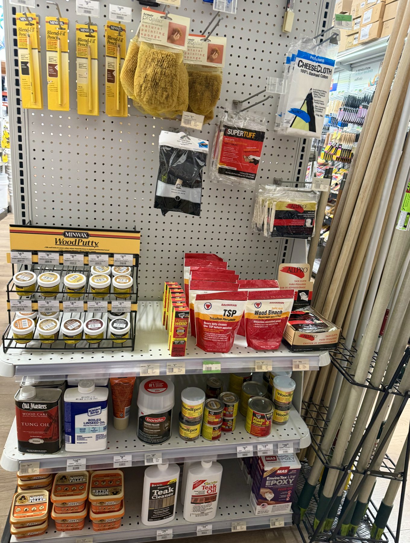 Minwax Wood Putty display, Old Masters Tung Oil, Klean-Strip Boiled Linseed Oil, Savogran TSP, and wood restoration supplies at Hessler Paint & Hardware in Delray Beach, Florida.