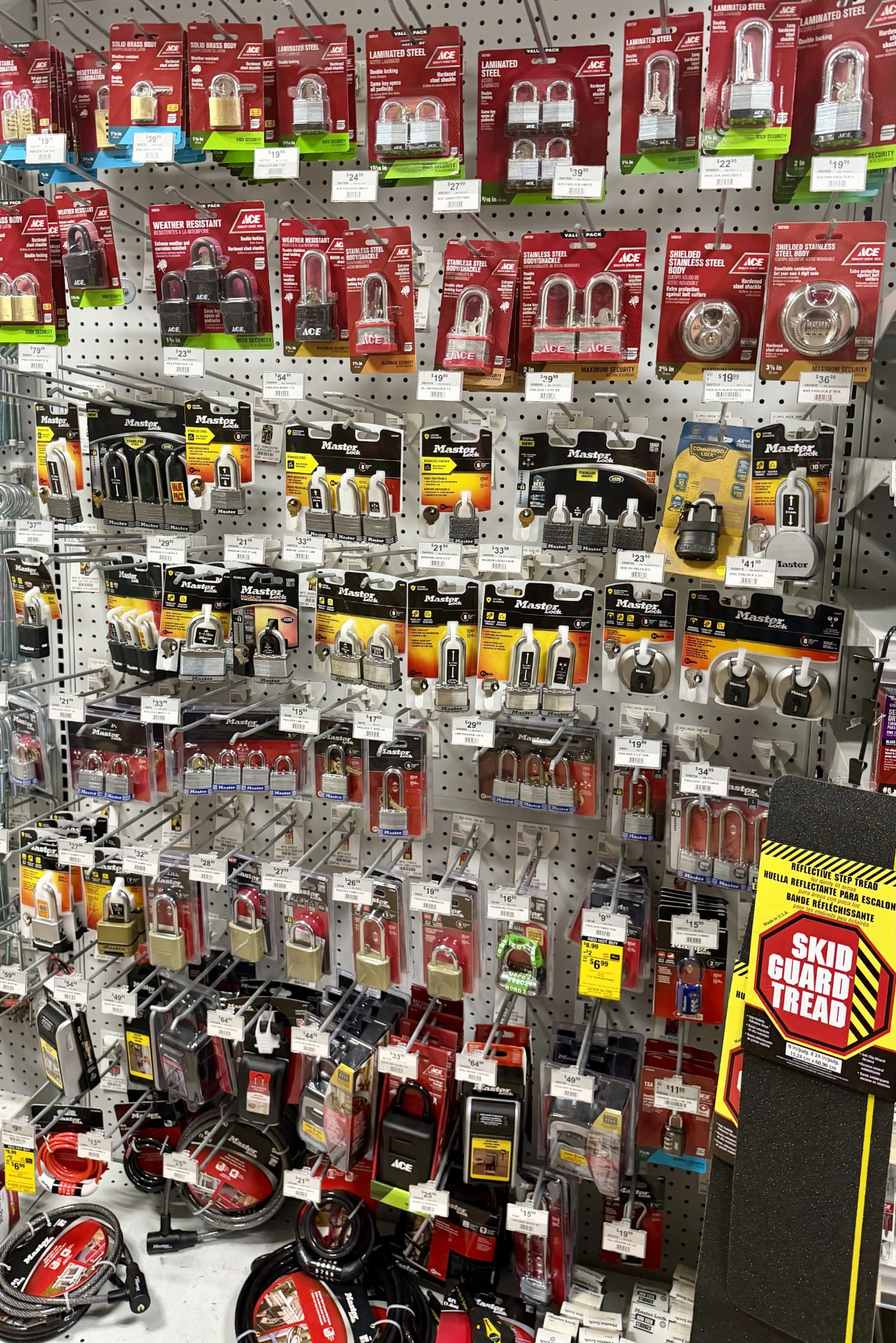 Wall of Master Lock and Ace padlocks, combination locks and cable locks